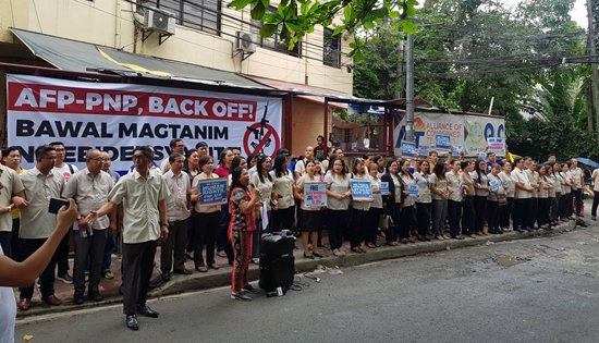 ACT human barricade outside their office